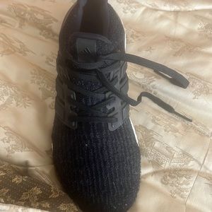 Black Adidas boost sneakers,